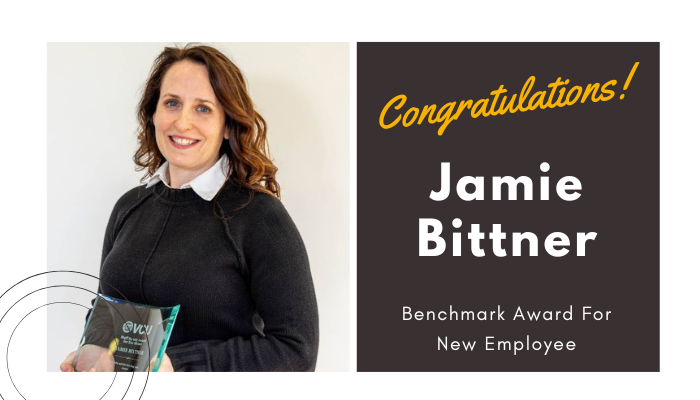 jamie bittner holding her award / congratulations jamie bittner benchmark new employee award