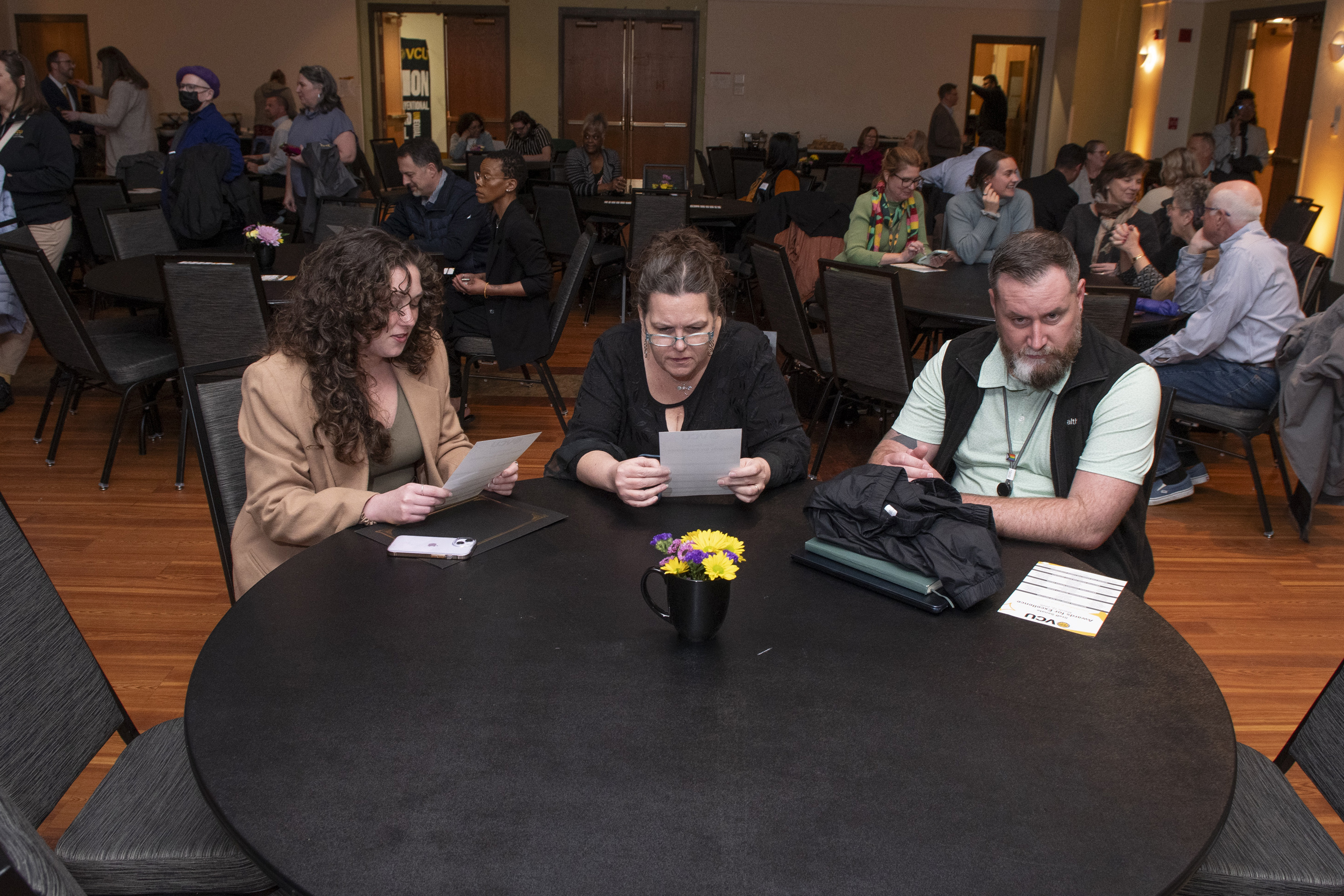 Attendees sitting at a table