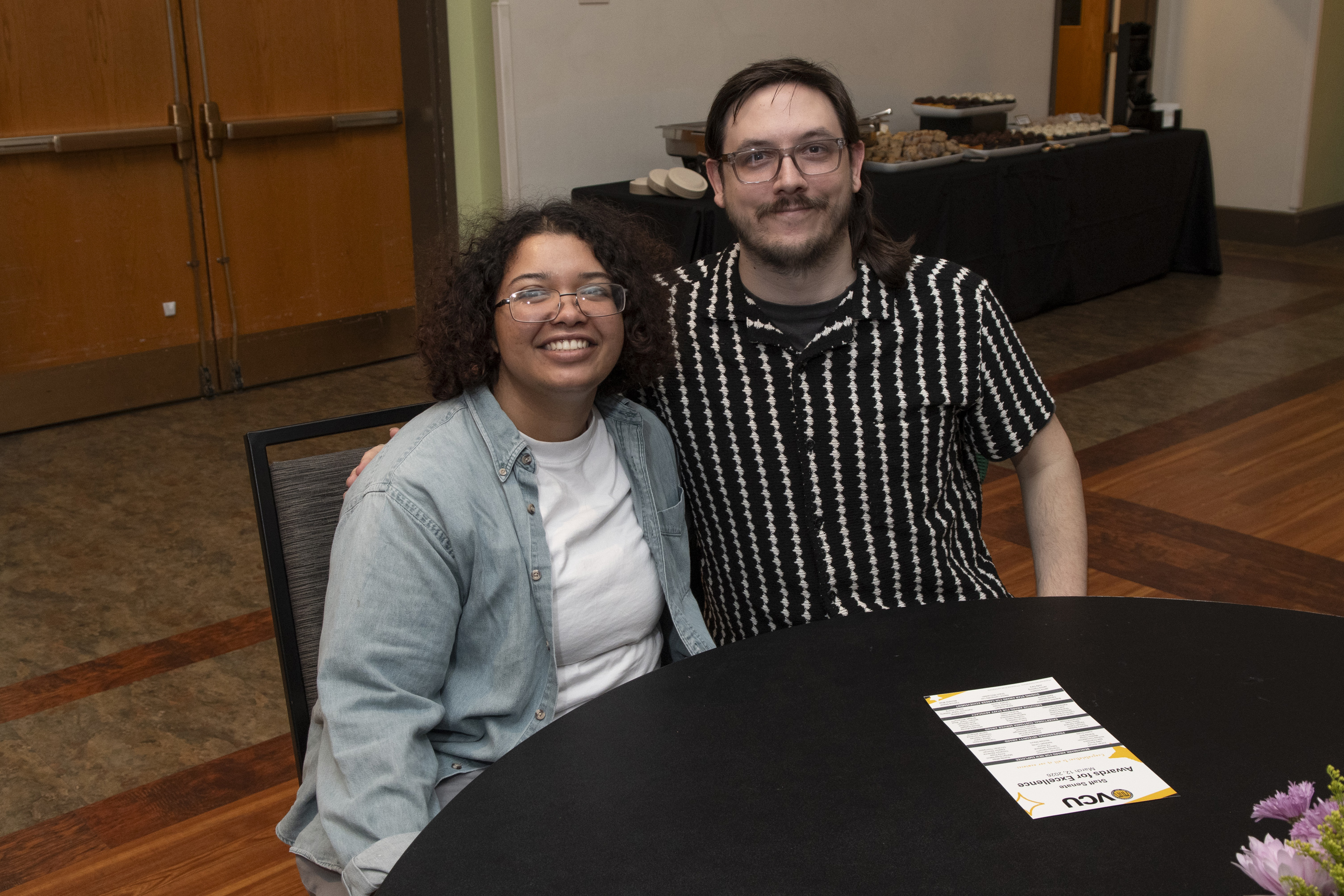 Attendees sitting at a table