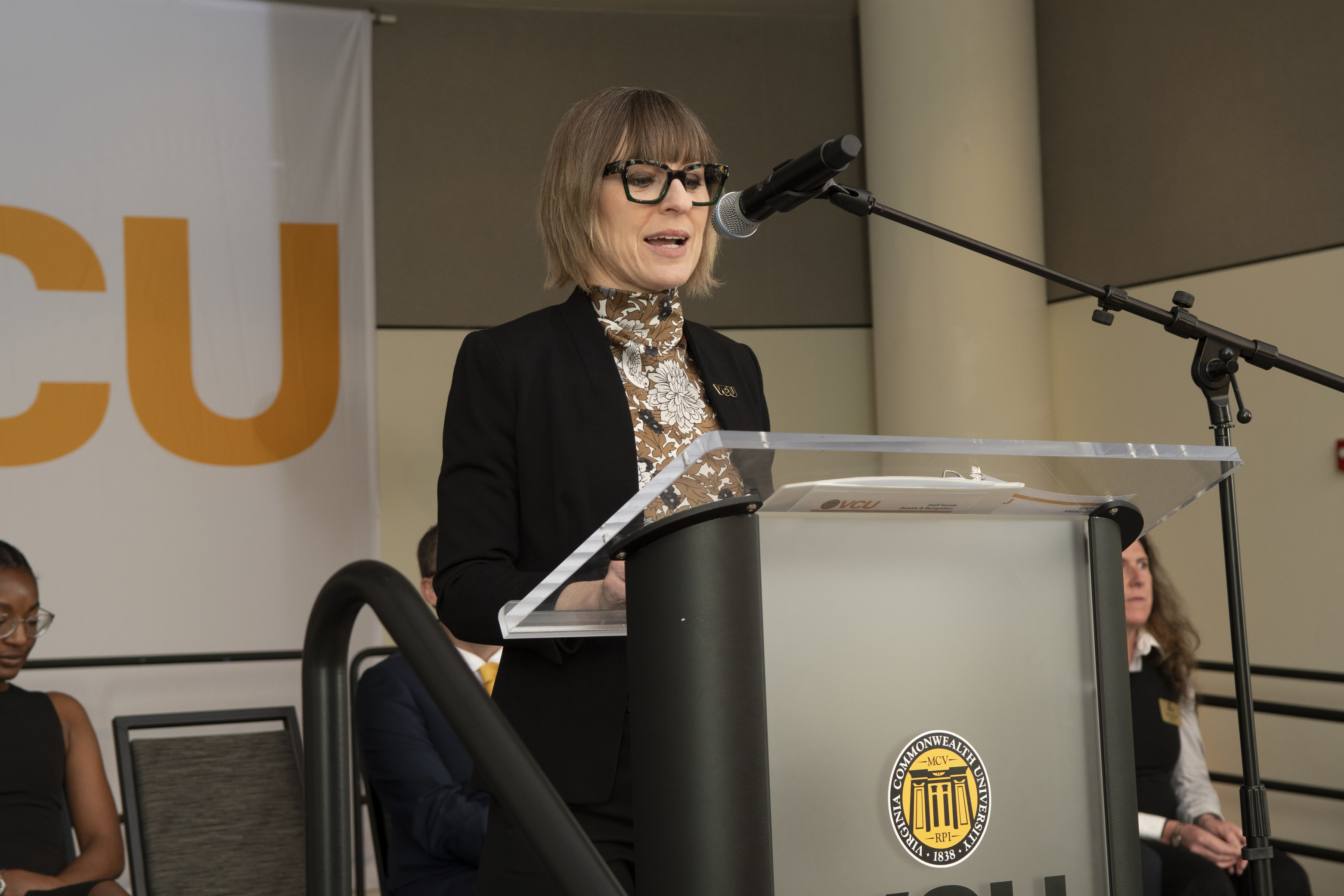 Sarah McCall speaking to audience